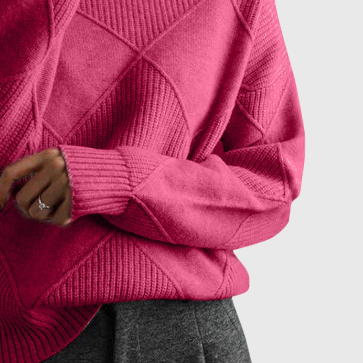 Women’s rose-colored sweater featuring a stylish geometric pattern and a cozy turtleneck design, perfect for comfortable layering in cooler weather. 1