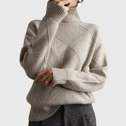Women’s rose-colored sweater featuring a stylish geometric pattern and a cozy turtleneck design, perfect for comfortable layering in cooler weather. 9