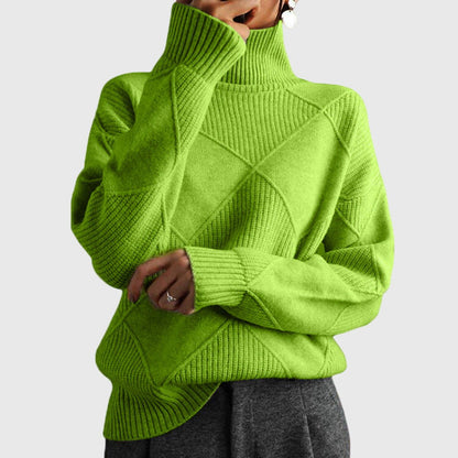 Women’s rose-colored sweater featuring a stylish geometric pattern and a cozy turtleneck design, perfect for comfortable layering in cooler weather. 6