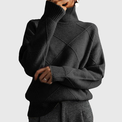 Women’s rose-colored sweater featuring a stylish geometric pattern and a cozy turtleneck design, perfect for comfortable layering in cooler weather. 10