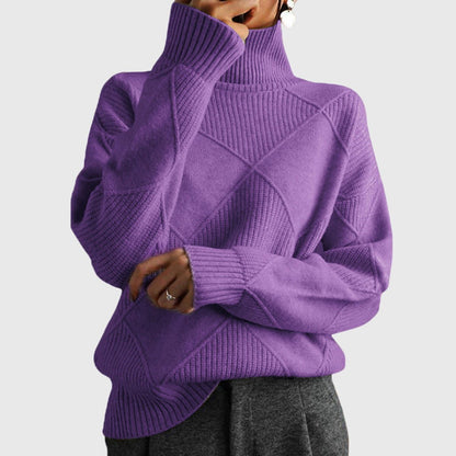 Women’s rose-colored sweater featuring a stylish geometric pattern and a cozy turtleneck design, perfect for comfortable layering in cooler weather. 3