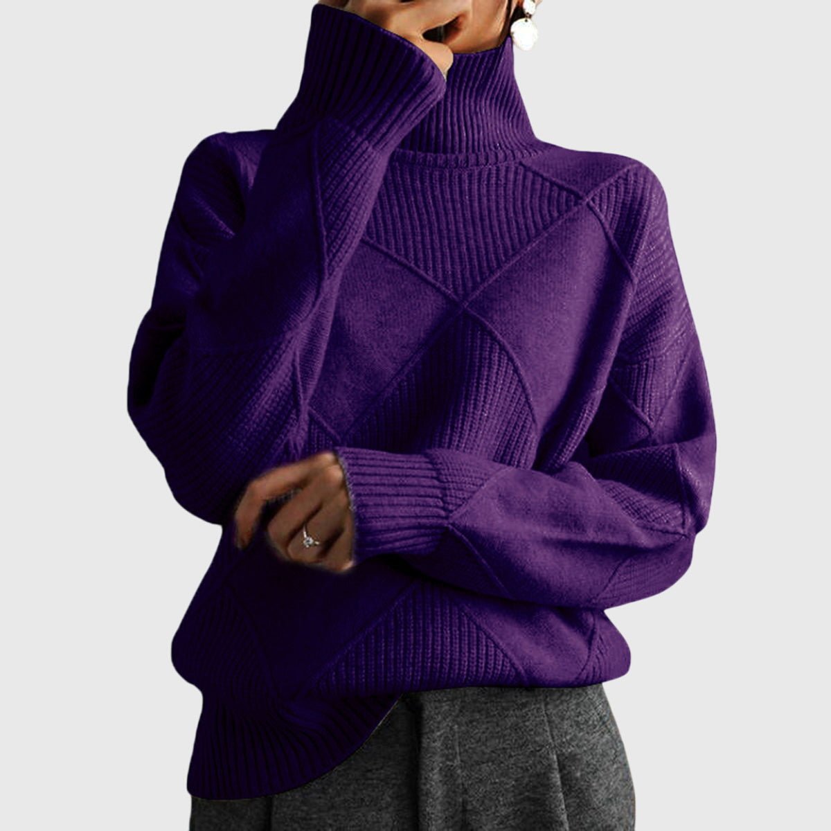 Women’s rose-colored sweater featuring a stylish geometric pattern and a cozy turtleneck design, perfect for comfortable layering in cooler weather. 12