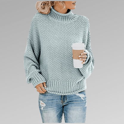 Women's orange high-neck sweater featuring a soft cozy knit and draped fit, perfect for stylish layering in cooler weather. 5