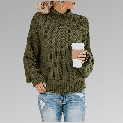 Women's orange high-neck sweater featuring a soft cozy knit and draped fit, perfect for stylish layering in cooler weather. 1