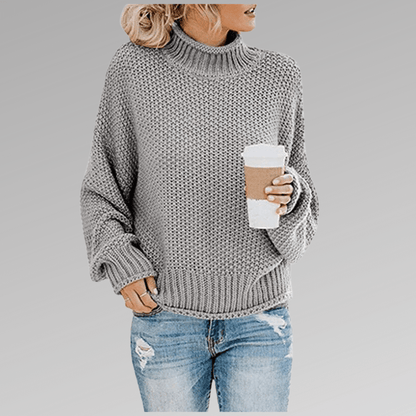 Women's orange high-neck sweater featuring a soft cozy knit and draped fit, perfect for stylish layering in cooler weather. 4