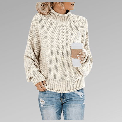 Women's orange high-neck sweater featuring a soft cozy knit and draped fit, perfect for stylish layering in cooler weather. 7