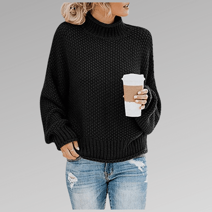 Women's orange high-neck sweater featuring a soft cozy knit and draped fit, perfect for stylish layering in cooler weather. 2