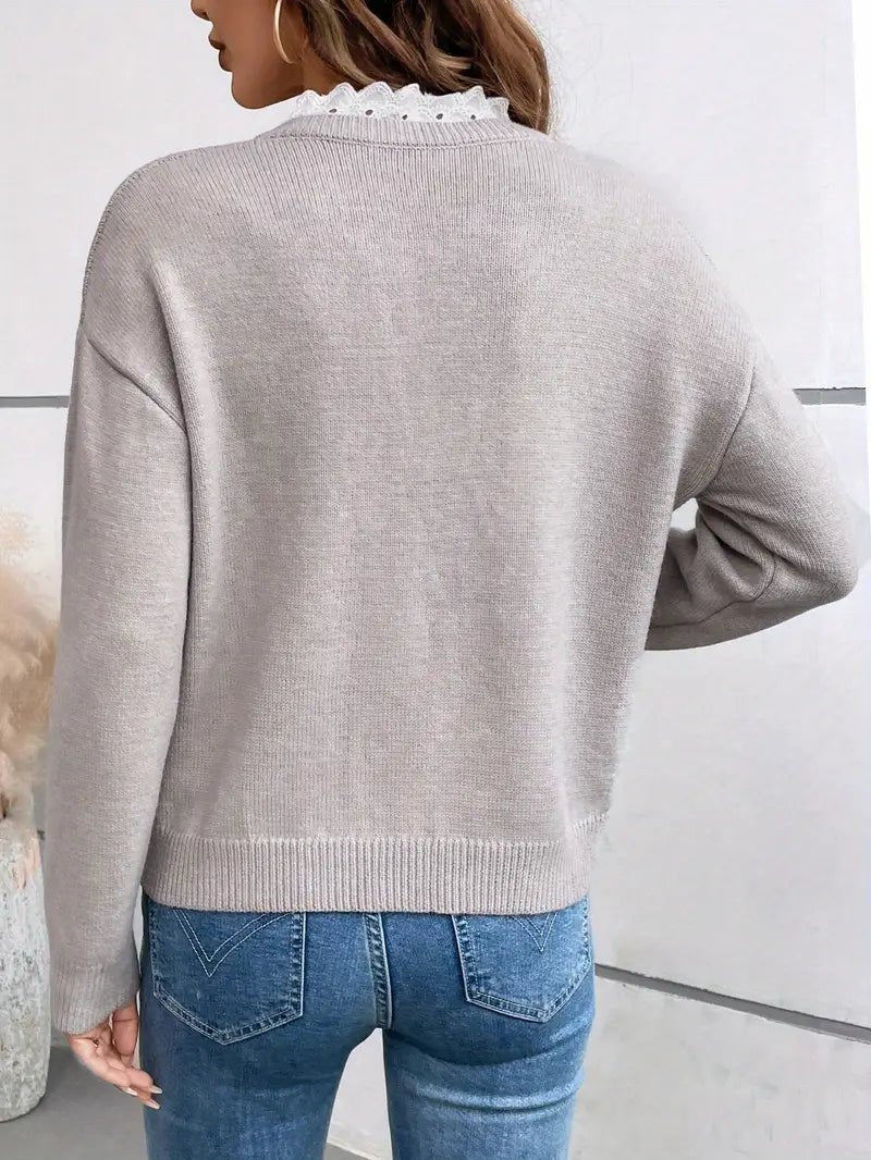 Elegant women's sweater featuring delicate lace detail and a classic cut, perfect for comfortable everyday wear. 4
