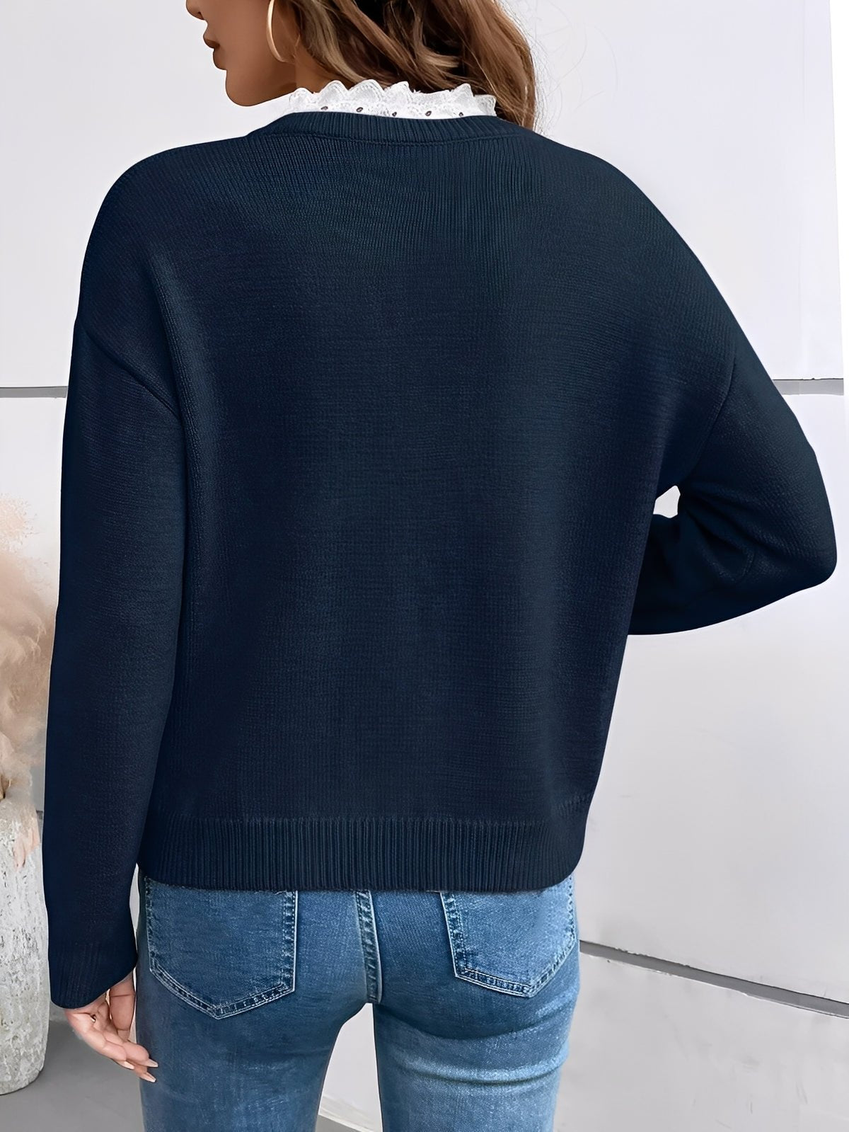 Elegant women's sweater featuring delicate lace detail and a classic cut, perfect for comfortable everyday wear. 2