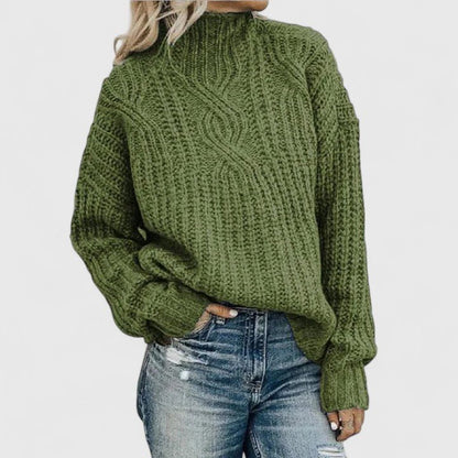 Women's cozy green sweater featuring a relaxed fit and classic cable knit design, perfect for transitional weather. 0