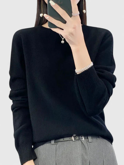 Women’s turquoise sweater featuring a relaxed fit and made from soft, warm material, perfect for cozy layering and versatile styling. 11