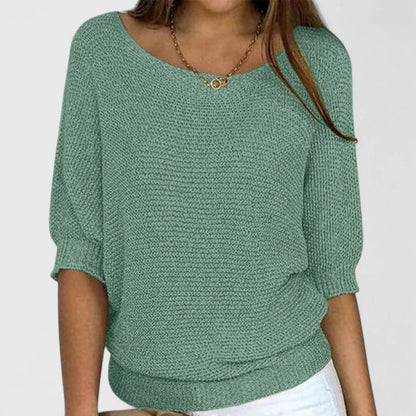 Women's green knit sweater featuring a soft and comfortable design, perfect for everyday wear with a timeless style. 0