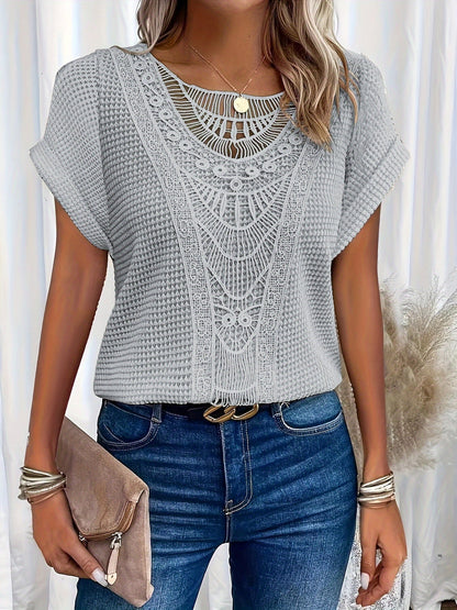 Women's relaxed fit top featuring a round neck and delicate lace trim, made from a comfortable cotton blend, perfect for an elegant casual look. 5