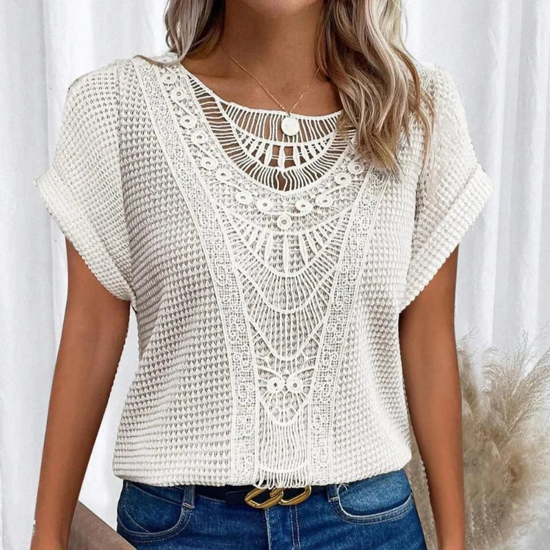 Women's relaxed fit top featuring a round neck and delicate lace trim, made from a comfortable cotton blend, perfect for an elegant casual look. 7