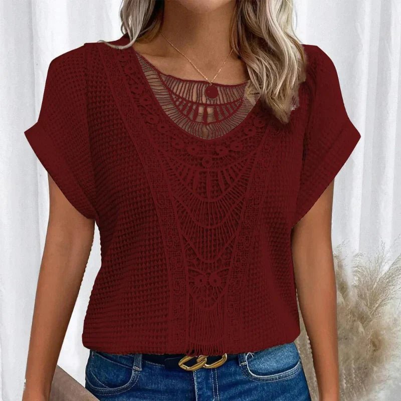 Women's relaxed fit top featuring a round neck and delicate lace trim, made from a comfortable cotton blend, perfect for an elegant casual look. 6
