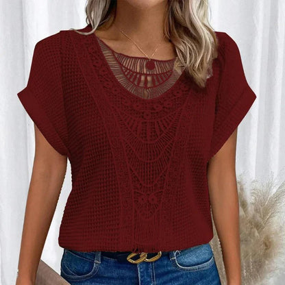 Women's relaxed fit top featuring a round neck and delicate lace trim, made from a comfortable cotton blend, perfect for an elegant casual look. 6