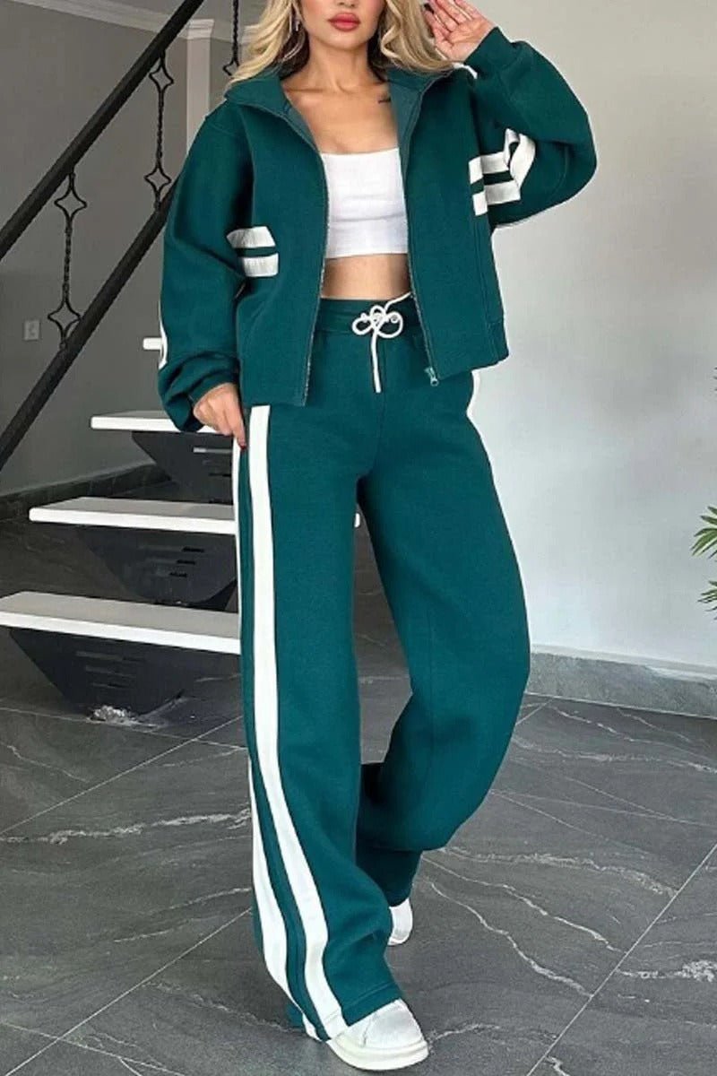 Womens tracksuit set featuring a zip-up jacket and wide-leg pants in a casual stripe design, made from a comfortable polyester blend. 2