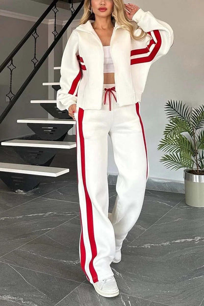 Womens tracksuit set featuring a zip-up jacket and wide-leg pants in a casual stripe design, made from a comfortable polyester blend. 0