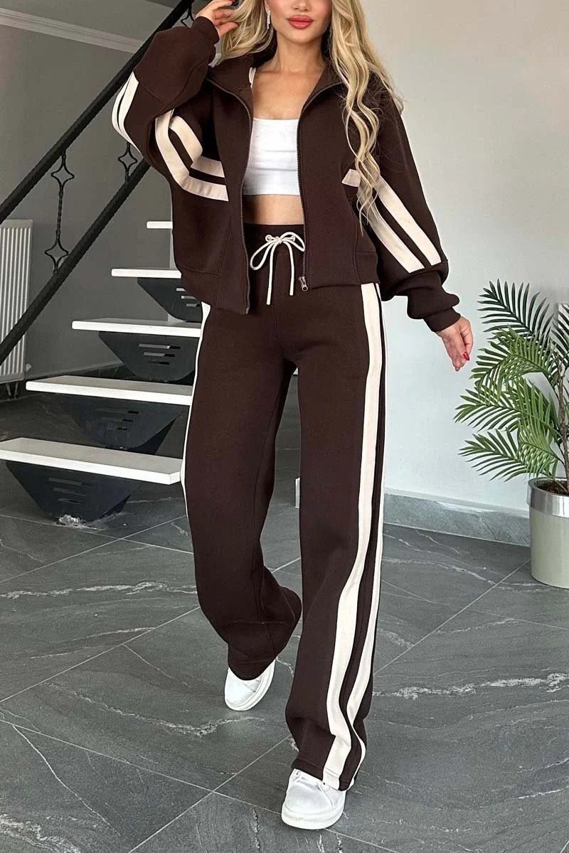 Womens tracksuit set featuring a zip-up jacket and wide-leg pants in a casual stripe design, made from a comfortable polyester blend. 3