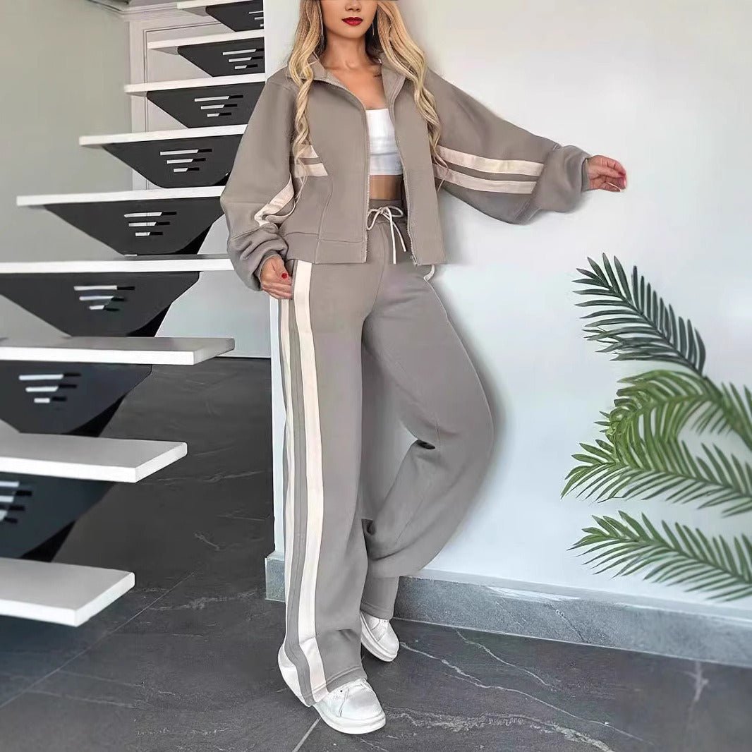 Womens tracksuit set featuring a zip-up jacket and wide-leg pants in a casual stripe design, made from a comfortable polyester blend. 4