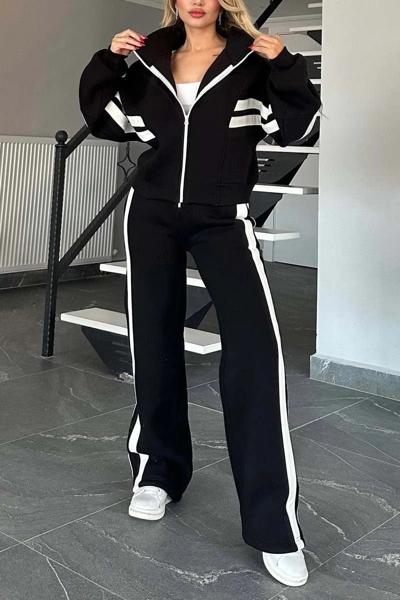Womens tracksuit set featuring a zip-up jacket and wide-leg pants in a casual stripe design, made from a comfortable polyester blend. 1