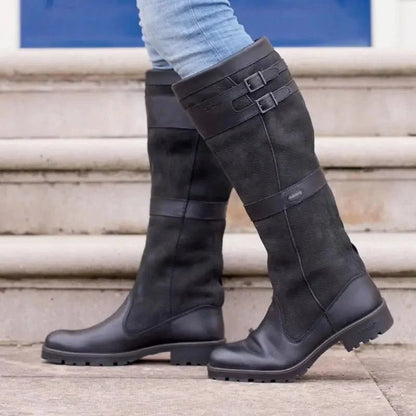Women's waterproof knee-high boots featuring a stylish double buckle design and an easy pull-on style, perfect for all-weather wear. 1