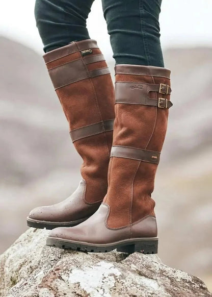 Women's waterproof knee-high boots featuring a stylish double buckle design and an easy pull-on style, perfect for all-weather wear. 2