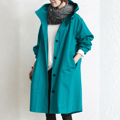 Women's lightweight waterproof rain jacket featuring an adjustable hood, perfect for outdoor adventures in wet weather. 4