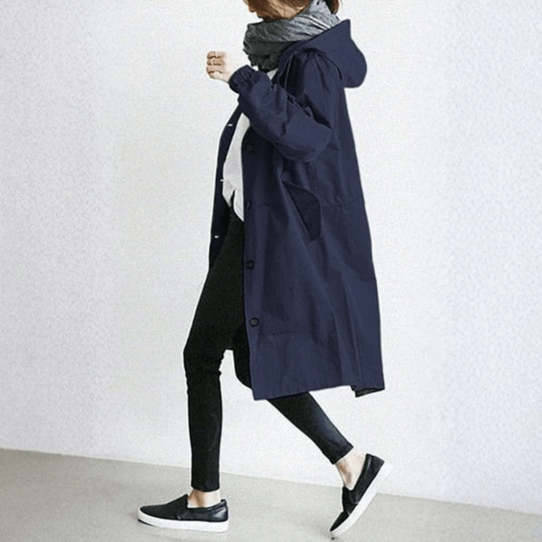 Women's lightweight waterproof rain jacket featuring an adjustable hood, perfect for outdoor adventures in wet weather. 3