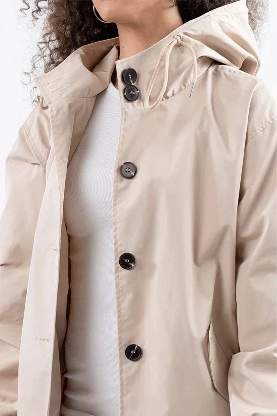 Women's lightweight waterproof rain jacket featuring an adjustable hood, perfect for outdoor adventures in wet weather. 7