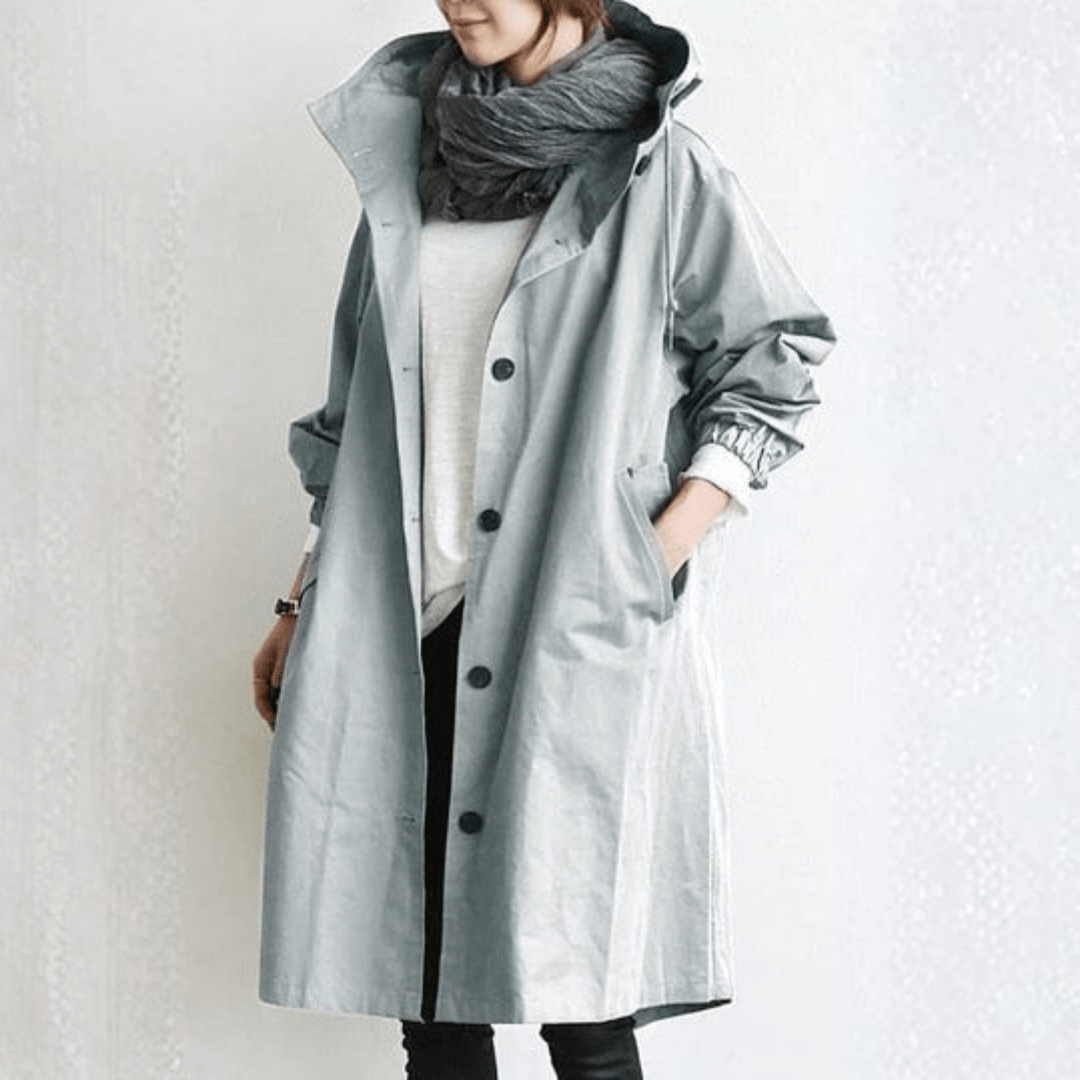 Women's lightweight waterproof rain jacket featuring an adjustable hood, perfect for outdoor adventures in wet weather. 2