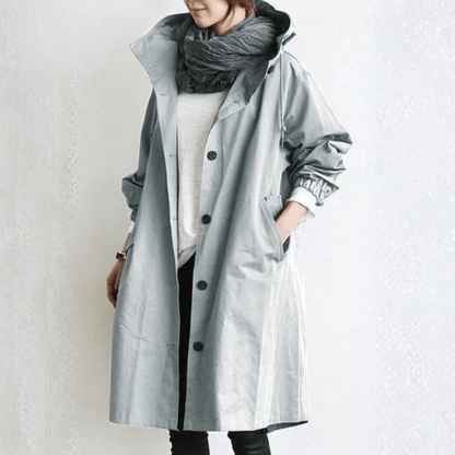 Women's lightweight waterproof rain jacket featuring an adjustable hood, perfect for outdoor adventures in wet weather. 2