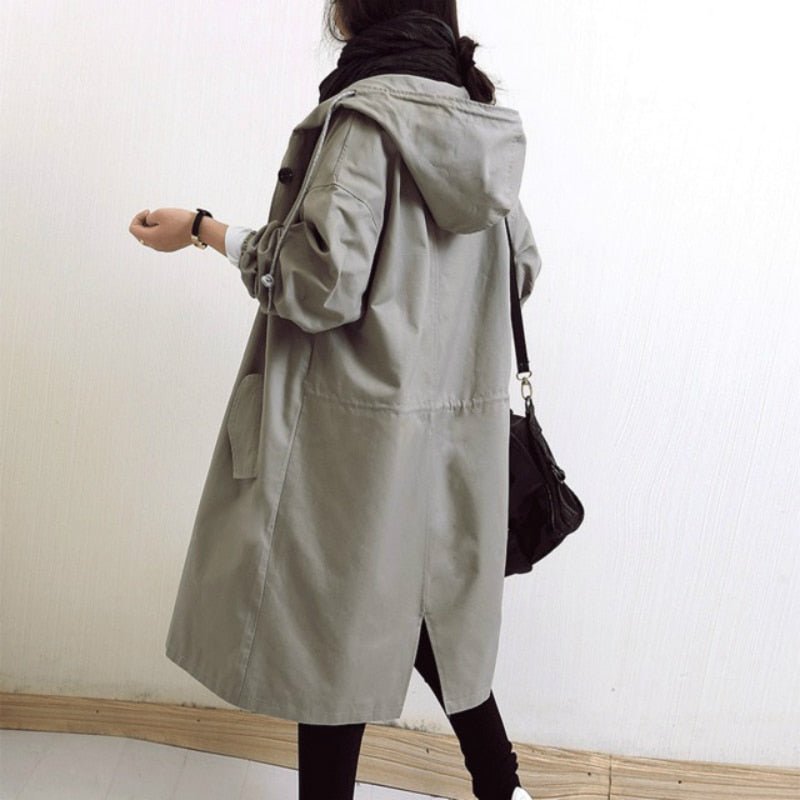 Women's lightweight waterproof rain jacket featuring an adjustable hood, perfect for outdoor adventures in wet weather. 6