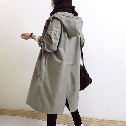 Women's lightweight waterproof rain jacket featuring an adjustable hood, perfect for outdoor adventures in wet weather. 6