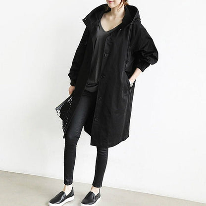 Women's lightweight waterproof rain jacket featuring an adjustable hood, perfect for outdoor adventures in wet weather. 1