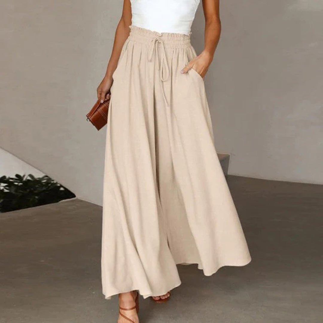 Women's wide leg pants featuring a high waist and drawstring tie, designed in a lightweight and breathable palazzo style, perfect for comfort and effortless elegance. 6