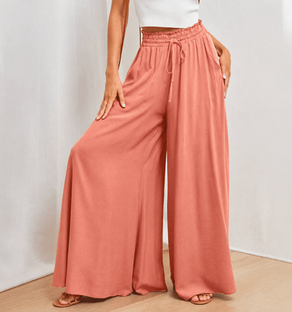 Women's wide leg pants featuring a high waist and drawstring tie, designed in a lightweight and breathable palazzo style, perfect for comfort and effortless elegance. 2