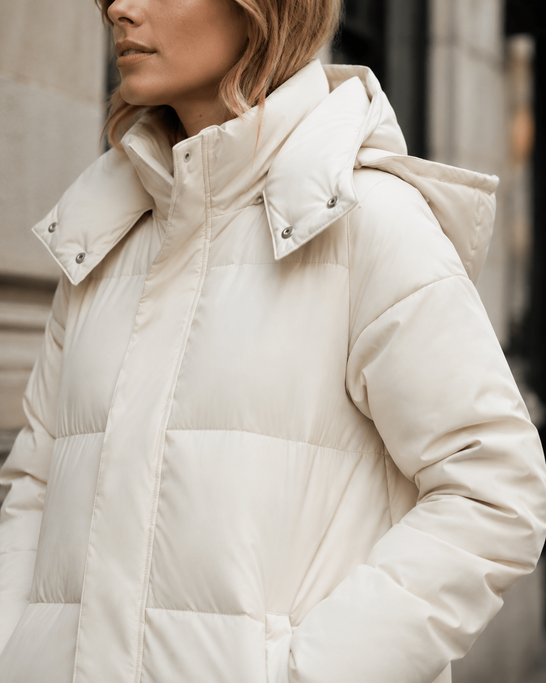 Women's windproof winter jacket featuring an extended length and relaxed fit, designed for durability and warmth in cold weather conditions. 3