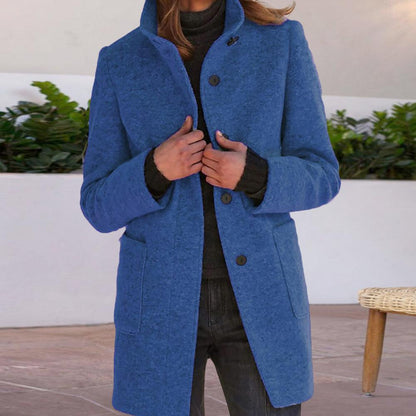 Women's wool coat featuring a tailored fit and timeless button design, perfect for elegant winter outerwear. 1