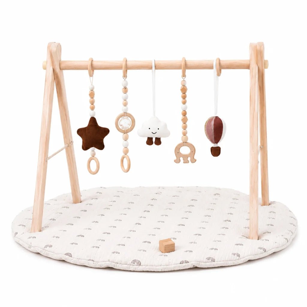 Wooden baby play gym featuring a natural wood frame and a colorful rainbow activity mat, designed for tummy time with detachable sensory toys for enhanced play and development 1