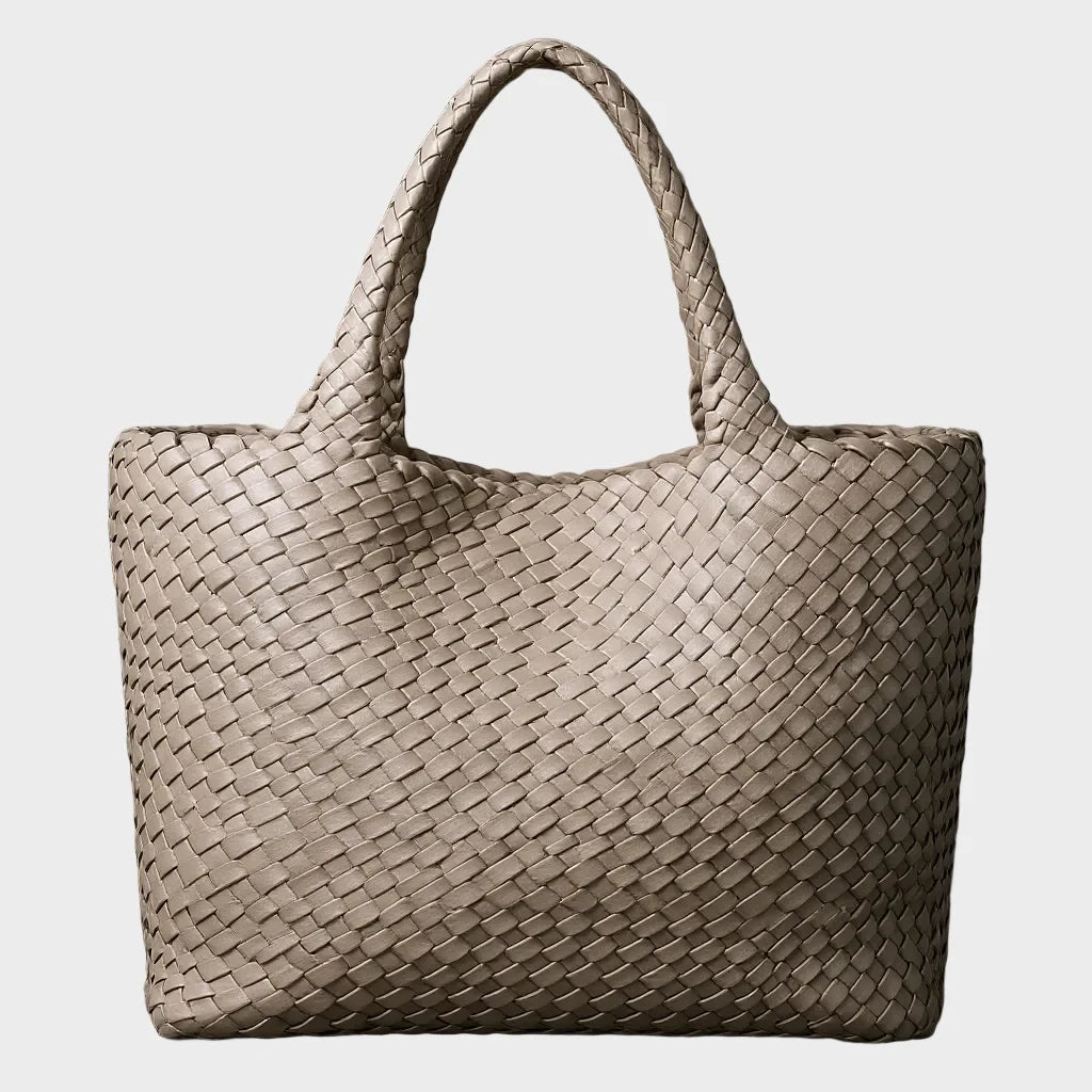 Woven leather tote bag featuring a spacious interior and comfortable handles, designed for everyday use with a timeless aesthetic. 6